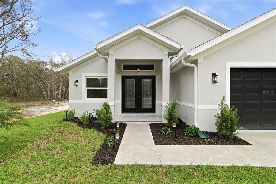 Front exterior of a new home in , Webster, FL, highlighting curb appeal (Image 24).