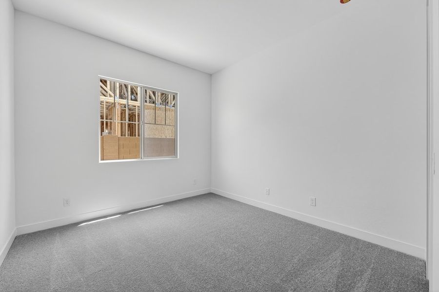 Spacious, unfurnished interior of a new home in Ellsworth Ranch, Queen Creek (Image 25).