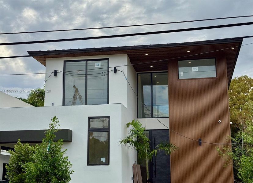 Exterior details and patio area of a home in , Surfside (Image 1).