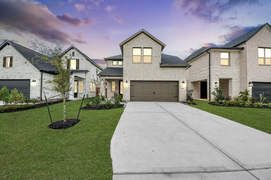 Front exterior of a new home in Elyson, Katy, TX, highlighting curb appeal (Image 25).