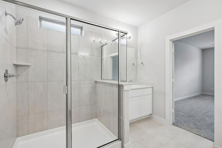 Primary Bathroom in the Winters home plan by Trophy Signature Homes – REPRESENTATIVE PHOTO