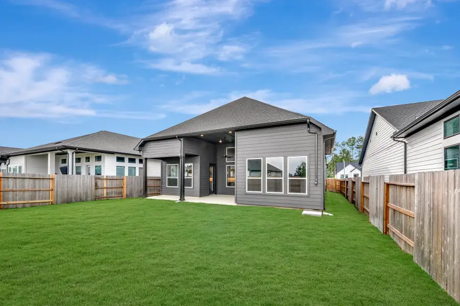 Exterior details and patio area of a home in ARTAVIA - Enclave Collection, Conroe (Image 30).