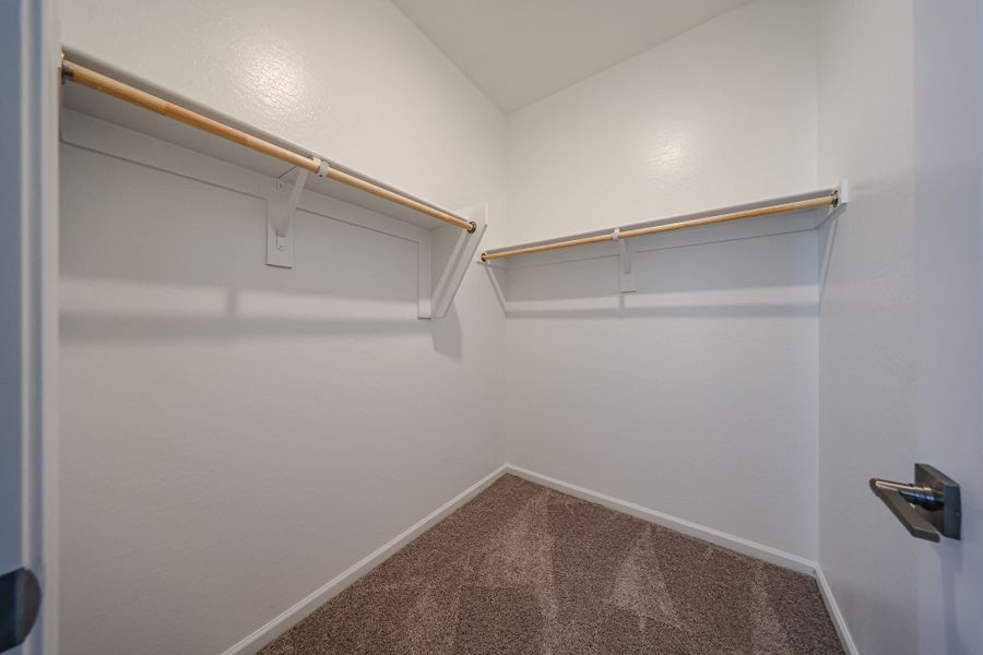 A room with a carpet and a rug.