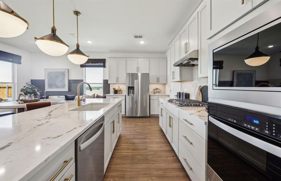 Open kitchen layout perfect for entertaining and creating a connected home environment *Model representation