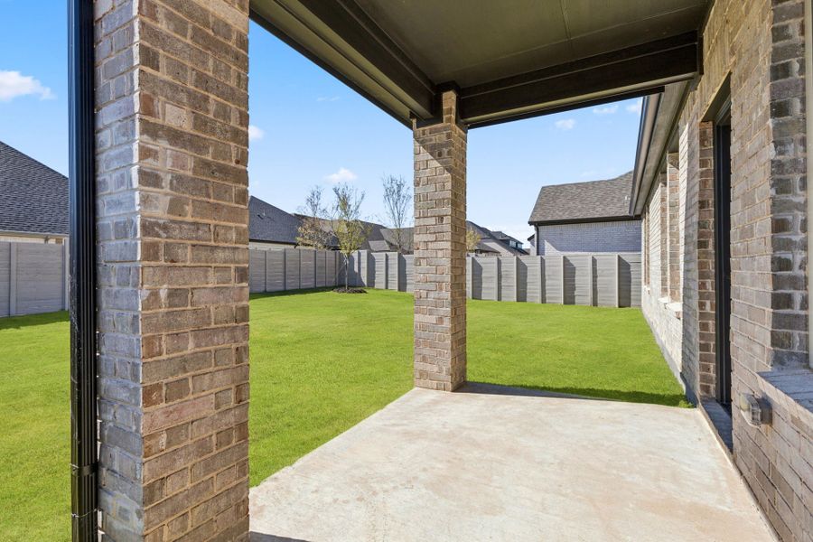 Exterior details and patio area of a home in Painted Tree Woodland West, McKinney (Image 24).
