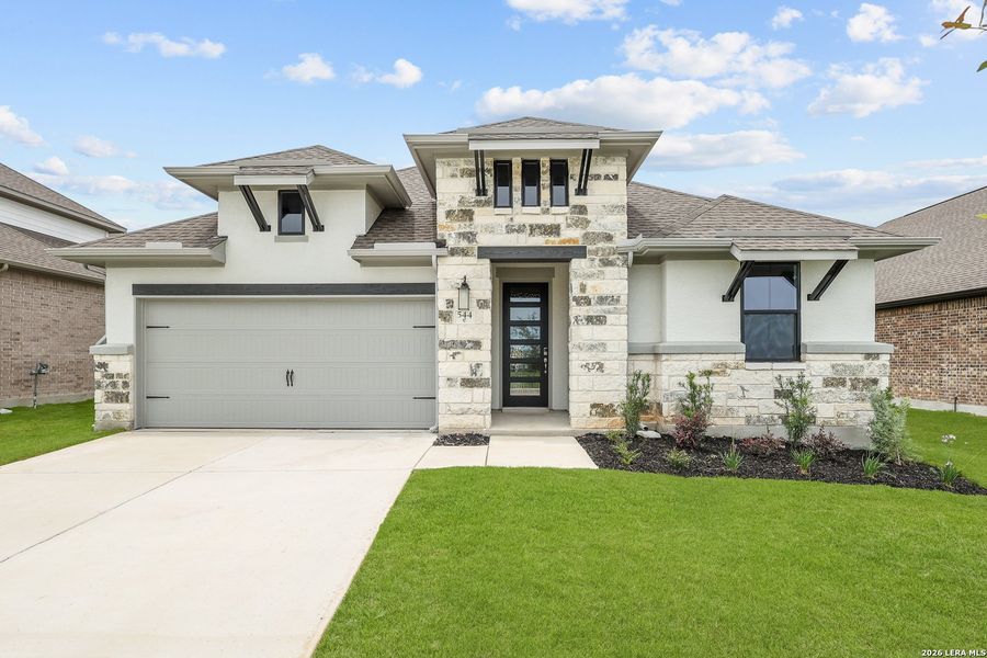 Front exterior of a new home in Buffalo Crossing, Cibolo, TX, highlighting curb appeal (Image 25).