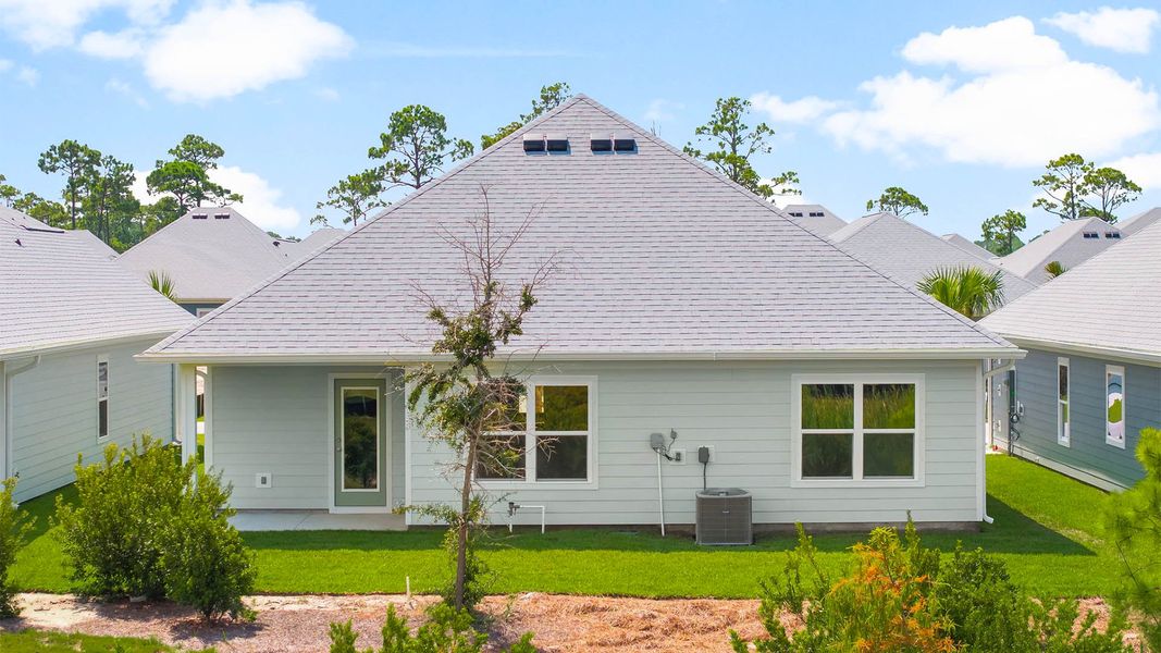 Front exterior of a new home in Windmark Beach, Port Saint Joe, FL, highlighting curb appeal (Image 15).