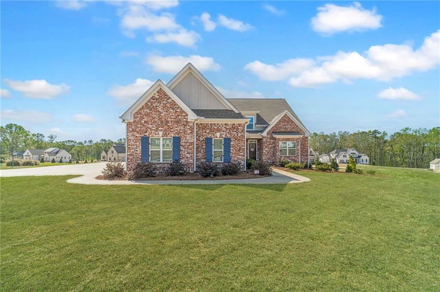 Front exterior of a new home in , Statham, GA, highlighting curb appeal (Image 1). Front exterior of a new home in , Statham, GA, highlighting curb appeal (Image 1).
