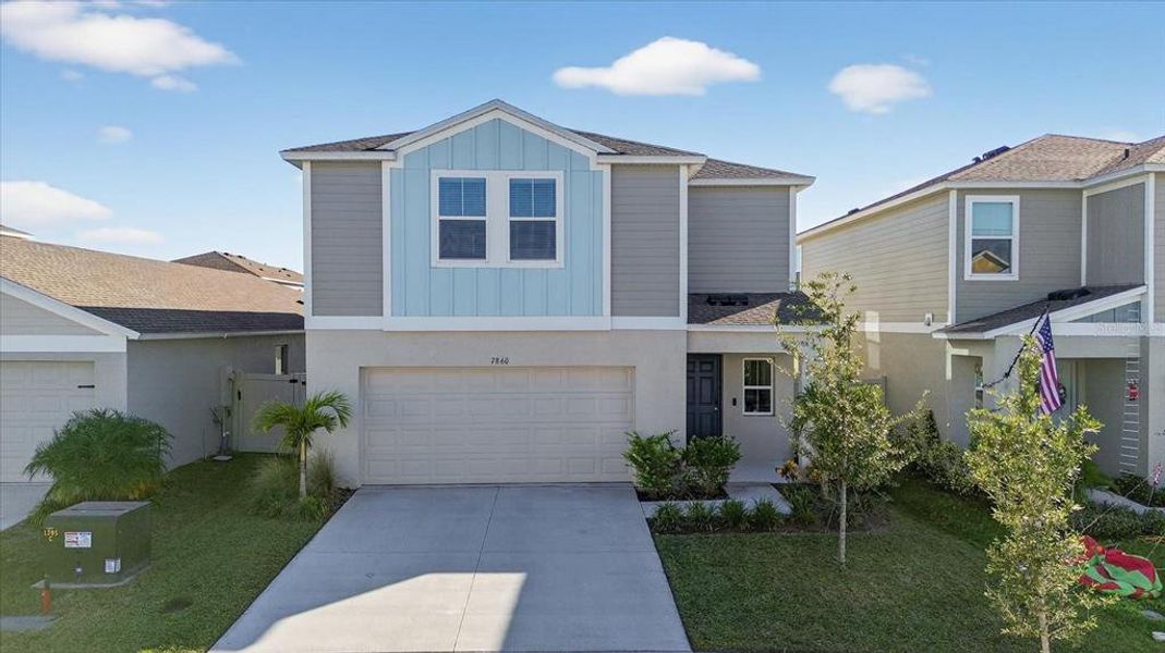 Front exterior of a new home in Pasadena Point, Wesley Chapel, FL, highlighting curb appeal (Image 1). Front exterior of a new home in Pasadena Point, Wesley Chapel, FL, highlighting curb appeal (Image 1).