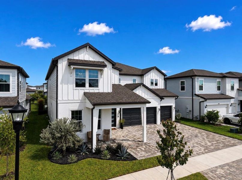 Front exterior of a new home in , Apollo Beach, FL, highlighting curb appeal (Image 2). Front exterior of a new home in , Apollo Beach, FL, highlighting curb appeal (Image 2).