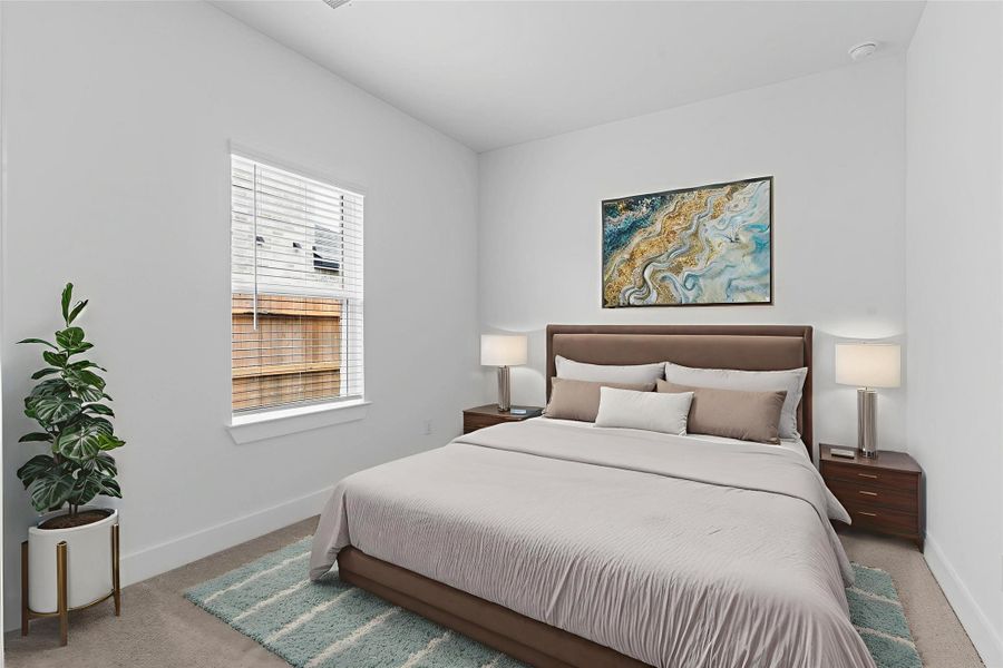 Secondary bedroom with soft carpet, bright window, and a spacious layout—perfect for guests, kids, or a private retreat.  All bedrooms have walk in closets! *Virtually Staged* **Image Representative of Plan Only and May Vary as Built**.