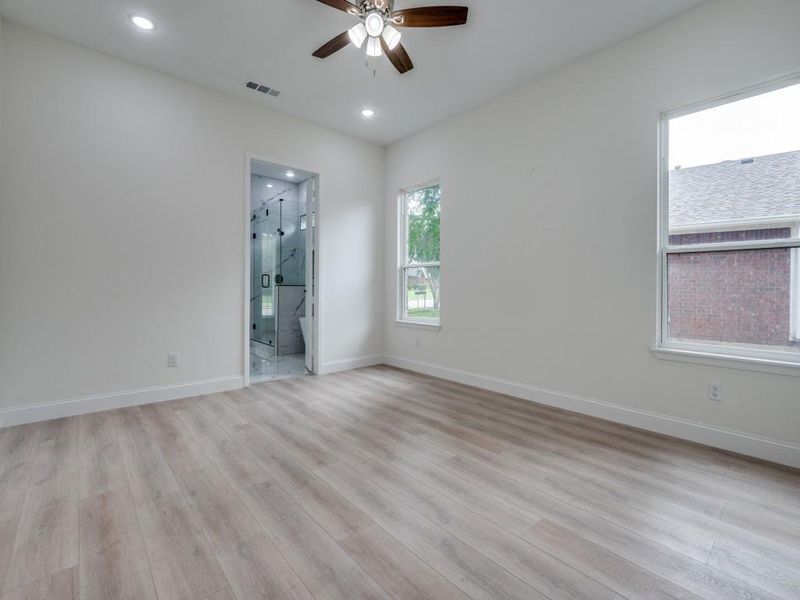 Empty room with ceiling fan, light wood-style flooring, baseboards, and recessed lighting