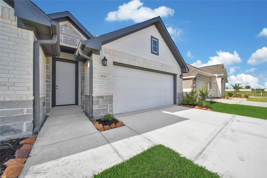 Front exterior of a new home in , Rosharon, TX, highlighting curb appeal (Image 17). Front exterior of a new home in , Rosharon, TX, highlighting curb appeal (Image 17).