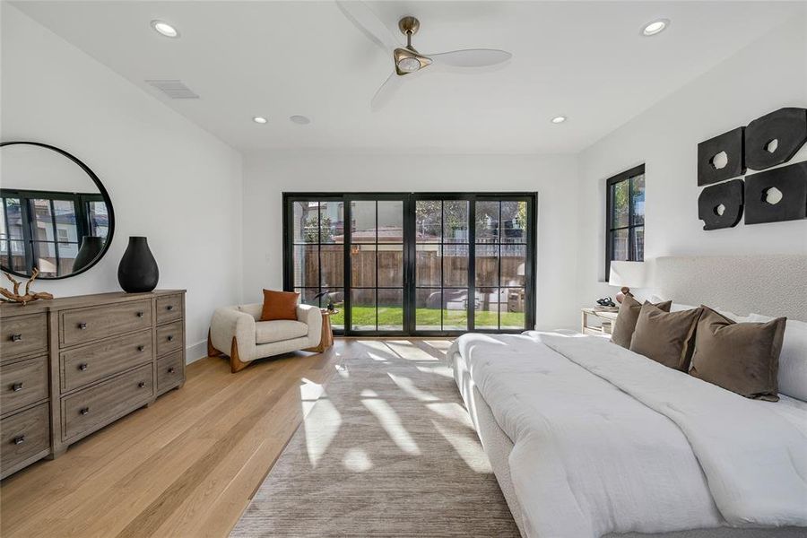 Room featuring wood-finish flooring, recessed lighting, and a ceiling fan