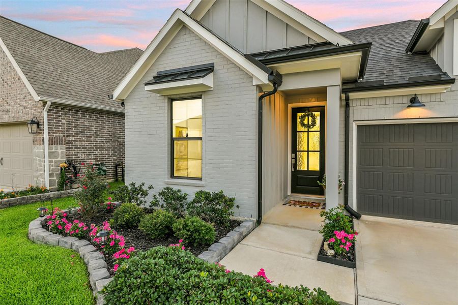 The painted brick and outdoor accents make this home a gem in desirable Amira.