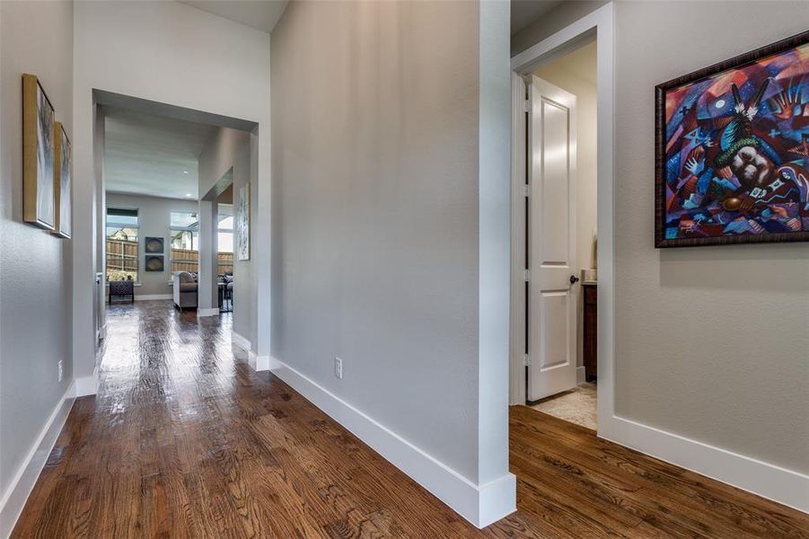 Gleaming real handscraped hardwood floors through the heart of the home