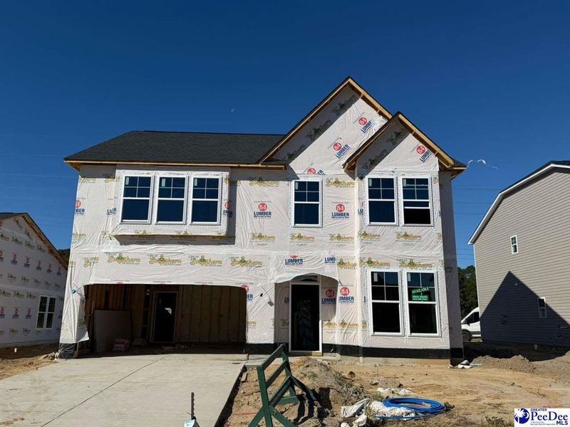 In-progress construction of a new home in The Grove, Florence, SC (Image 3).