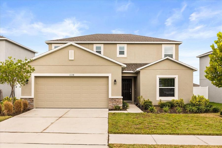 Front exterior of a new home in Parkside at Cherry Lake, Groveland, FL, highlighting curb appeal (Image 1). Front exterior of a new home in Parkside at Cherry Lake, Groveland, FL, highlighting curb appeal (Image 1).