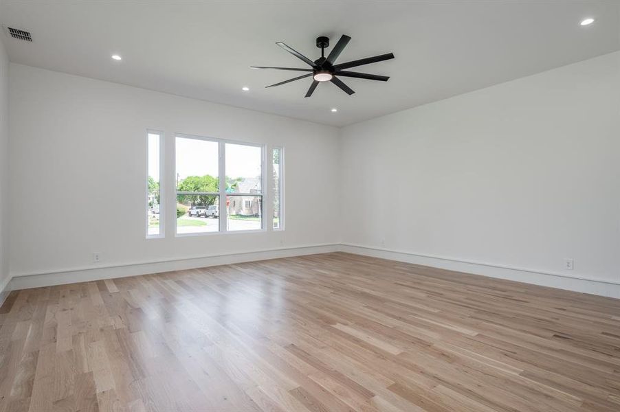 Unfurnished room featuring light wood-style floors, recessed lighting, and a ceiling fan Unfurnished room featuring light wood-style floors, recessed lighting, and a ceiling fan