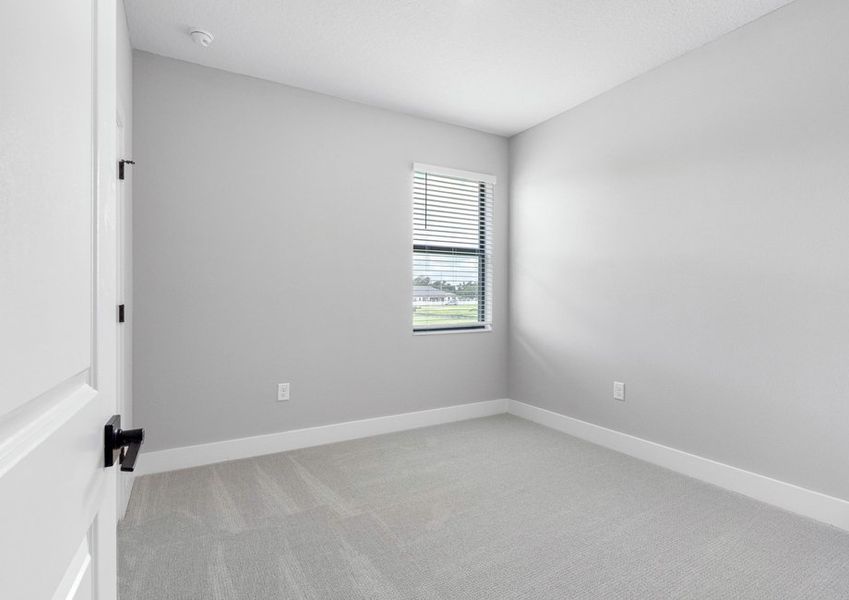 Each secondary bedroom includes carpets, a closet and bright windows