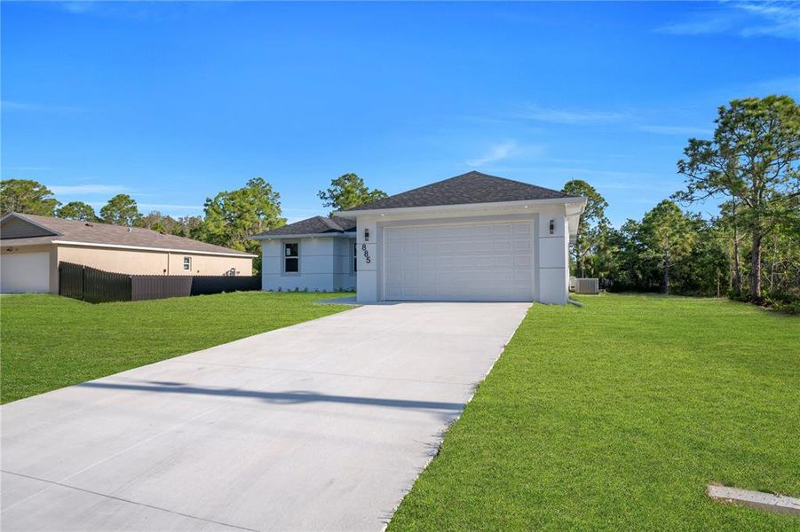 Front exterior of a new home in , Lehigh Acres, FL, highlighting curb appeal (Image 16). Front exterior of a new home in , Lehigh Acres, FL, highlighting curb appeal (Image 16).