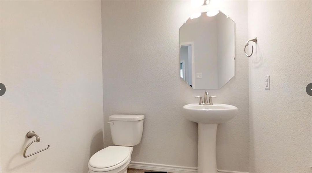 Bathroom featuring toilet and a sink