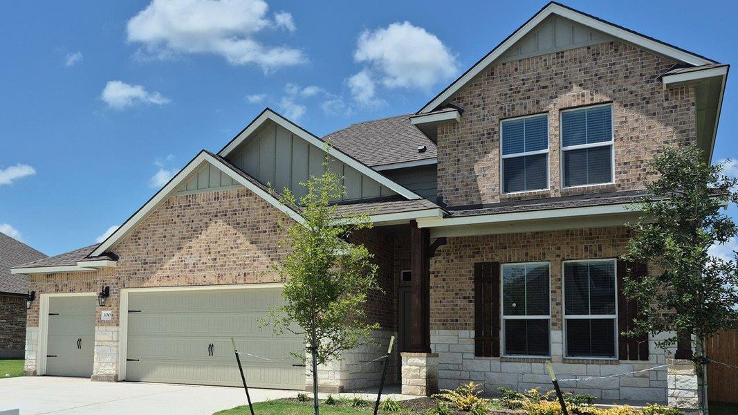 Front exterior of a new home in Country Meadows, Thorndale, TX, highlighting curb appeal (Image 20).
