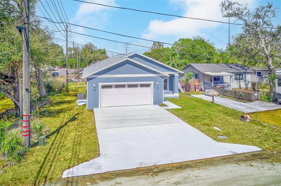 Front exterior of a new home in , St. Petersburg, FL, highlighting curb appeal (Image 25).