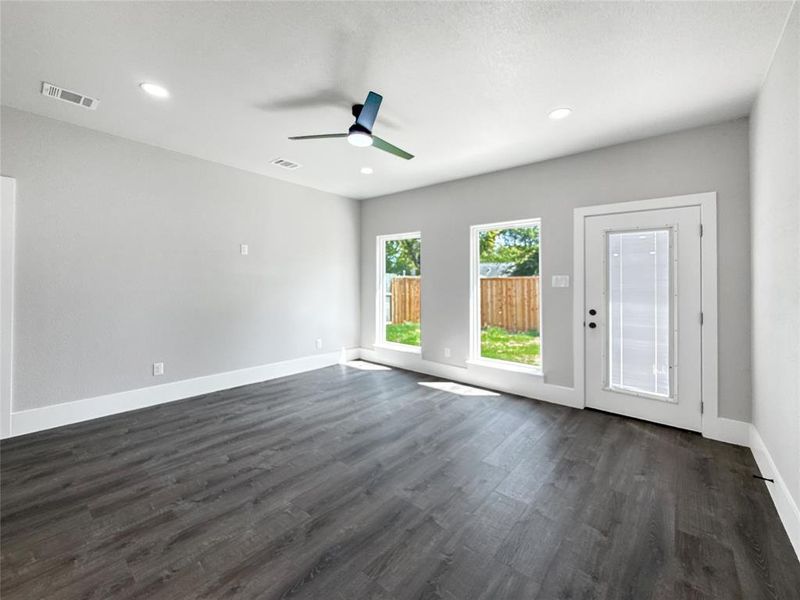 Unfurnished room with dark wood finished floors, recessed lighting, and a ceiling fan