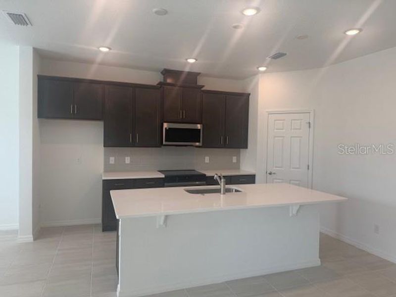 Furnished interior view inside a new home in Brack Ranch, St. Cloud (Image 6).