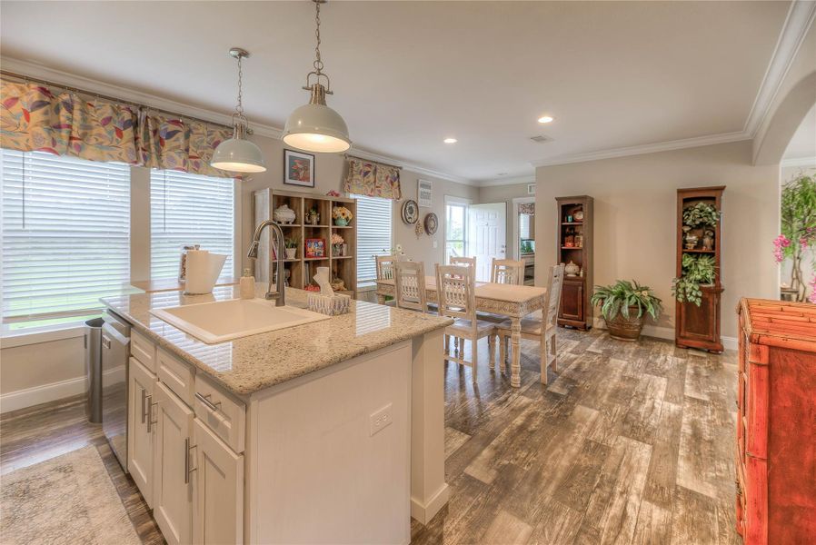 Large kitchen with granite countertops.