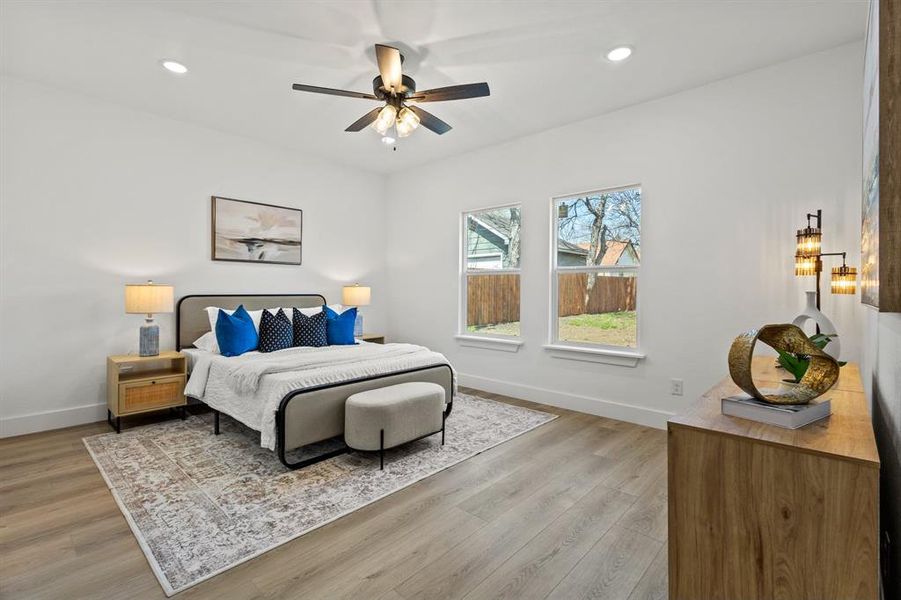 Bedroom featuring recessed lighting, baseboards, light wood finished floors, and ceiling fan