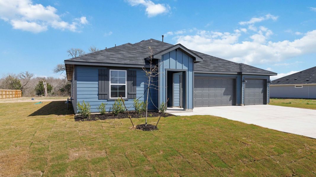 Front exterior of a new home in Railhead, Cedar Creek, TX, highlighting curb appeal (Image 14).