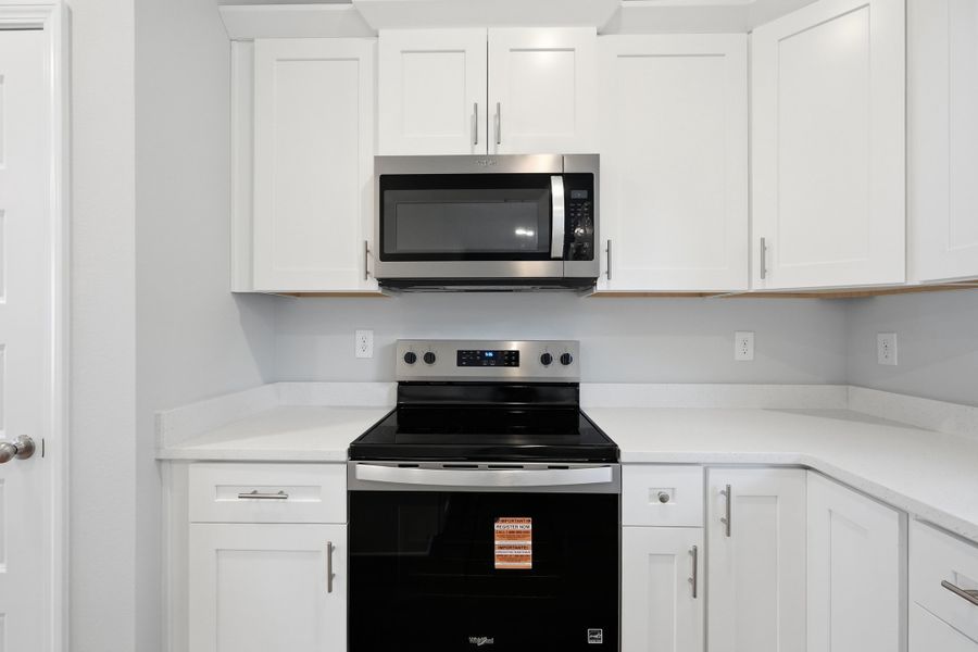 Furnished interior view inside a new home in Live Oak Cottages, Freeport (Image 7).