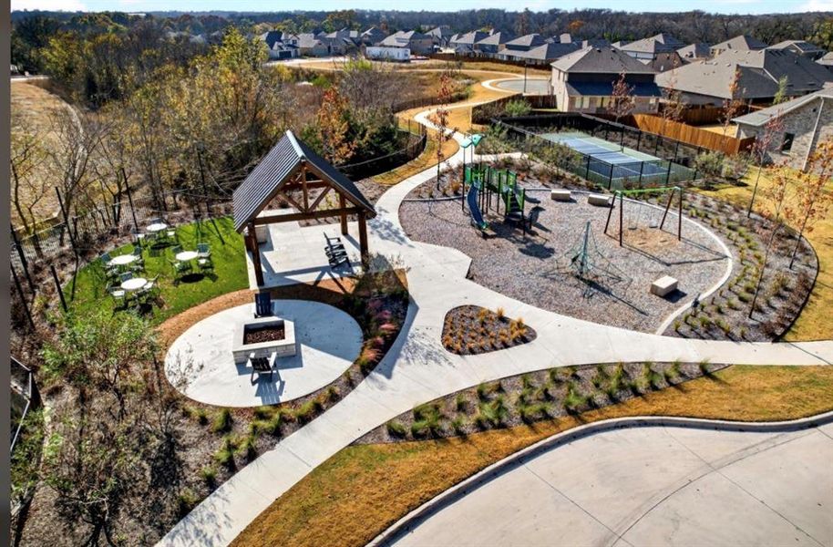 Surrounding community featuring a fire pit, a patio, and a residential view