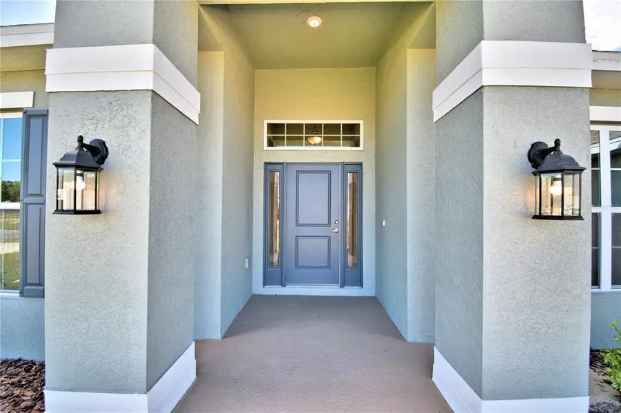 Exterior details and patio area of a home in Cadence Crossing, Auburndale (Image 3). Exterior details and patio area of a home in Cadence Crossing, Auburndale (Image 3).