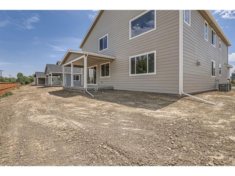 Exterior details and patio area of a home in Farmstead, Berthoud (Image 25).