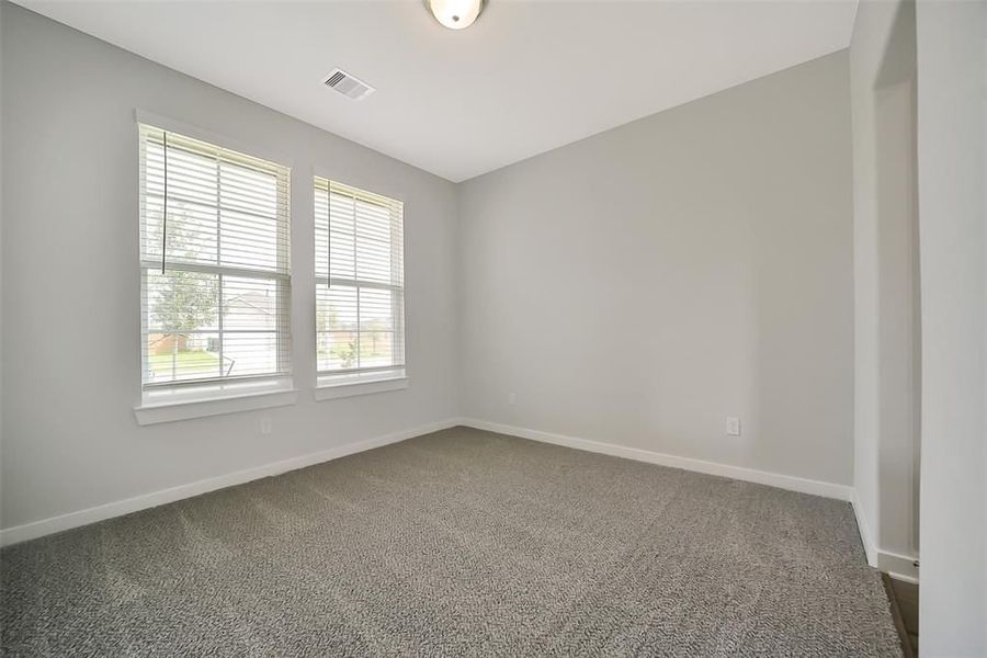 Spacious, unfurnished interior of a new home in Sunterra, Katy (Image 45).