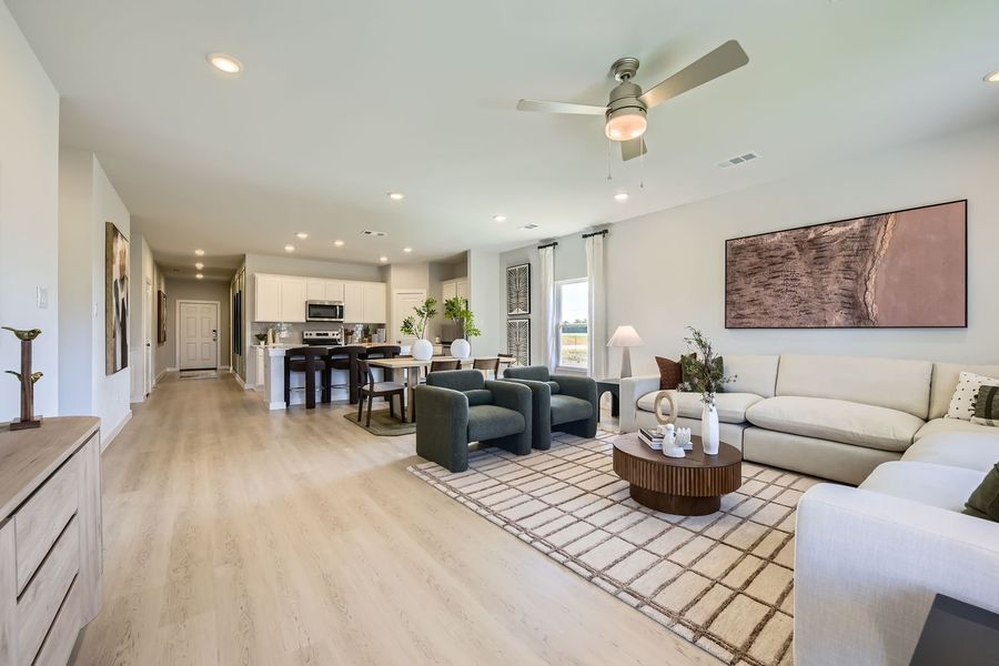 A living room with a wood floor. A living room with a wood floor.