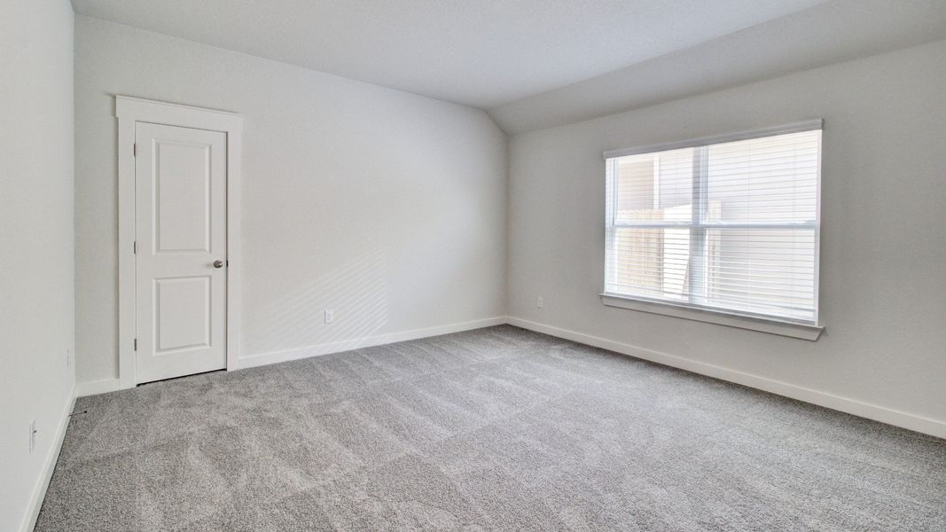 Representative furnished interior of a home built from the Paramount by Brightland Homes in Sunterra, Katy (Image 8).