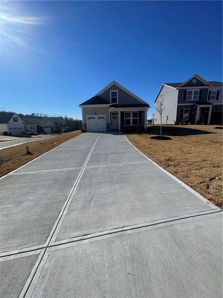 Front exterior of a new home in Springwood Grove, Central, SC, highlighting curb appeal (Image 2).