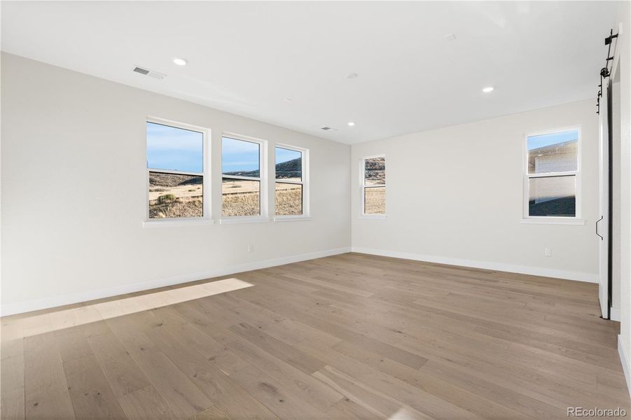 Spacious, unfurnished interior of a new home in Autograph at Lyric, Lone Tree (Image 23).