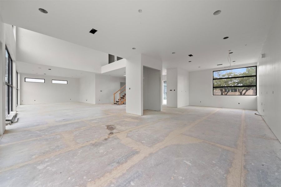 Dining room ideally positioned just off the kitchen, featuring expansive four-panel sliding doors to a balcony for seamless indoor-outdoor dining and open views across the first floor.