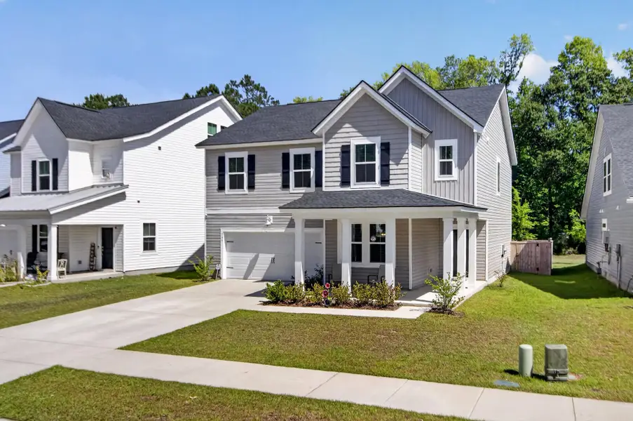 Front exterior of a new home in Limehouse Village: Arbor Series, Summerville, SC, highlighting curb appeal (Image 1). Front exterior of a new home in Limehouse Village: Arbor Series, Summerville, SC, highlighting curb appeal (Image 1).