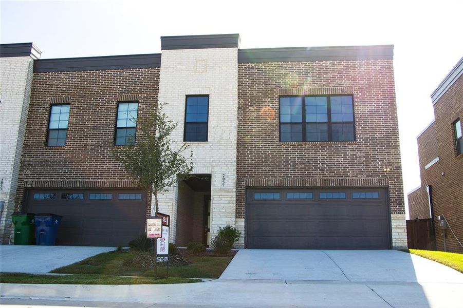 View of front of property with a garage