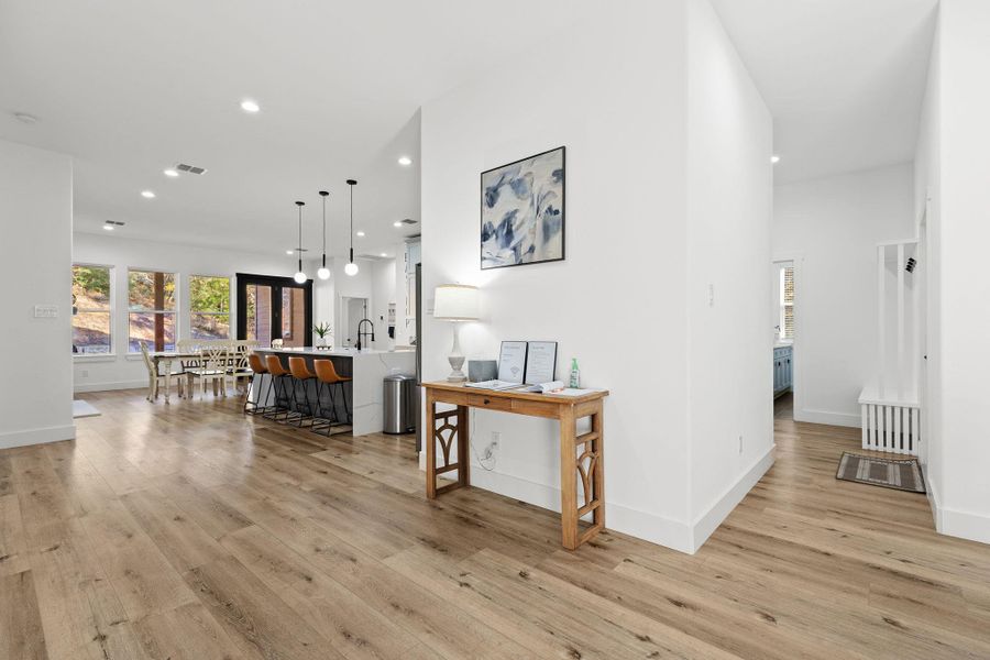 Hall featuring recessed lighting and light wood-style floors
