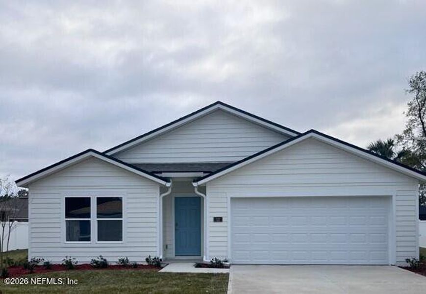 Front exterior of a new home in Palm Coast Homesites, Palm Coast, FL, highlighting curb appeal (Image 2).