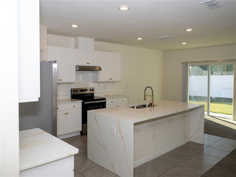 Furnished interior view inside a new home in Poinciana Enclave, Kissimmee (Image 4).