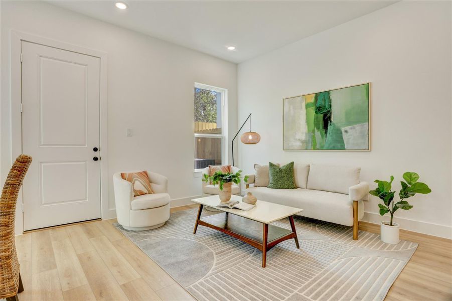 The dining/living room has a door leading to the low maintenance back yard.