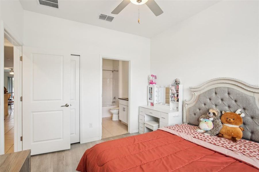 Guest bedroom with view into bathroom. Guest bedroom with view into bathroom.